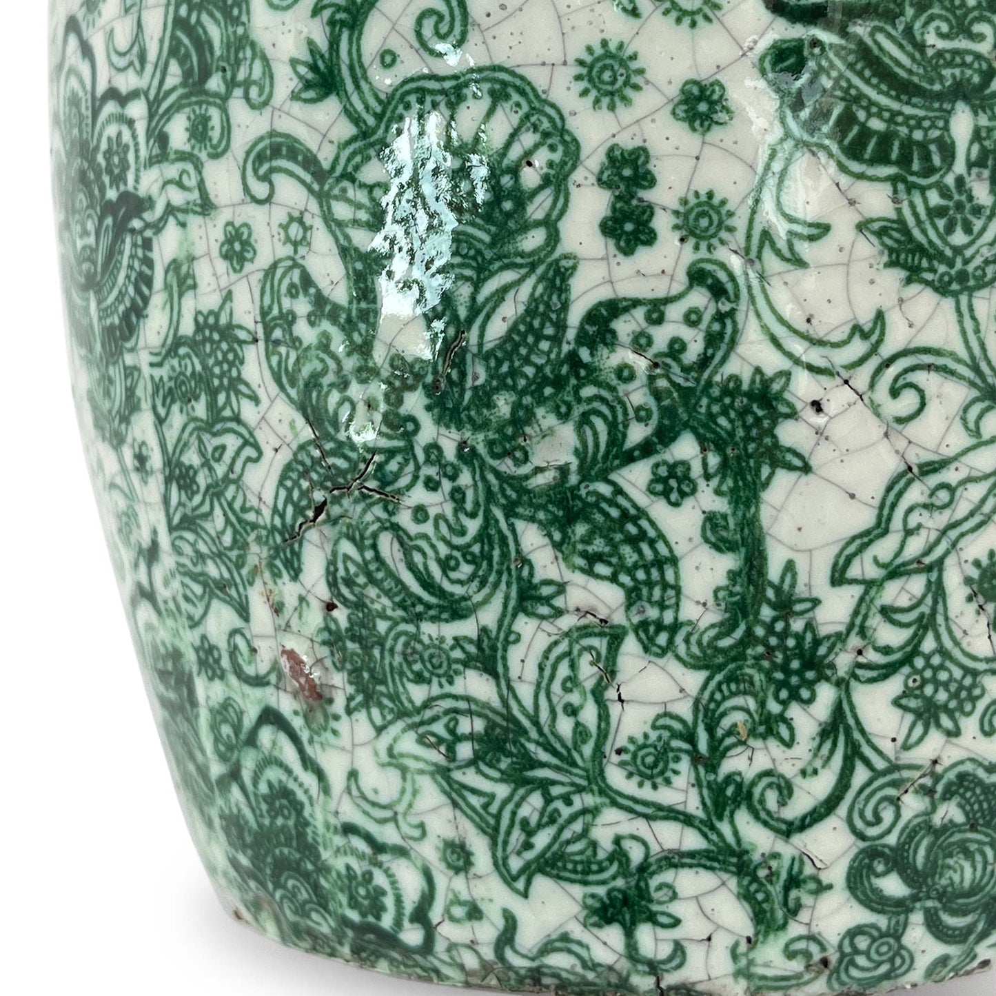 Close up of crackle glazed small planter in white and green.