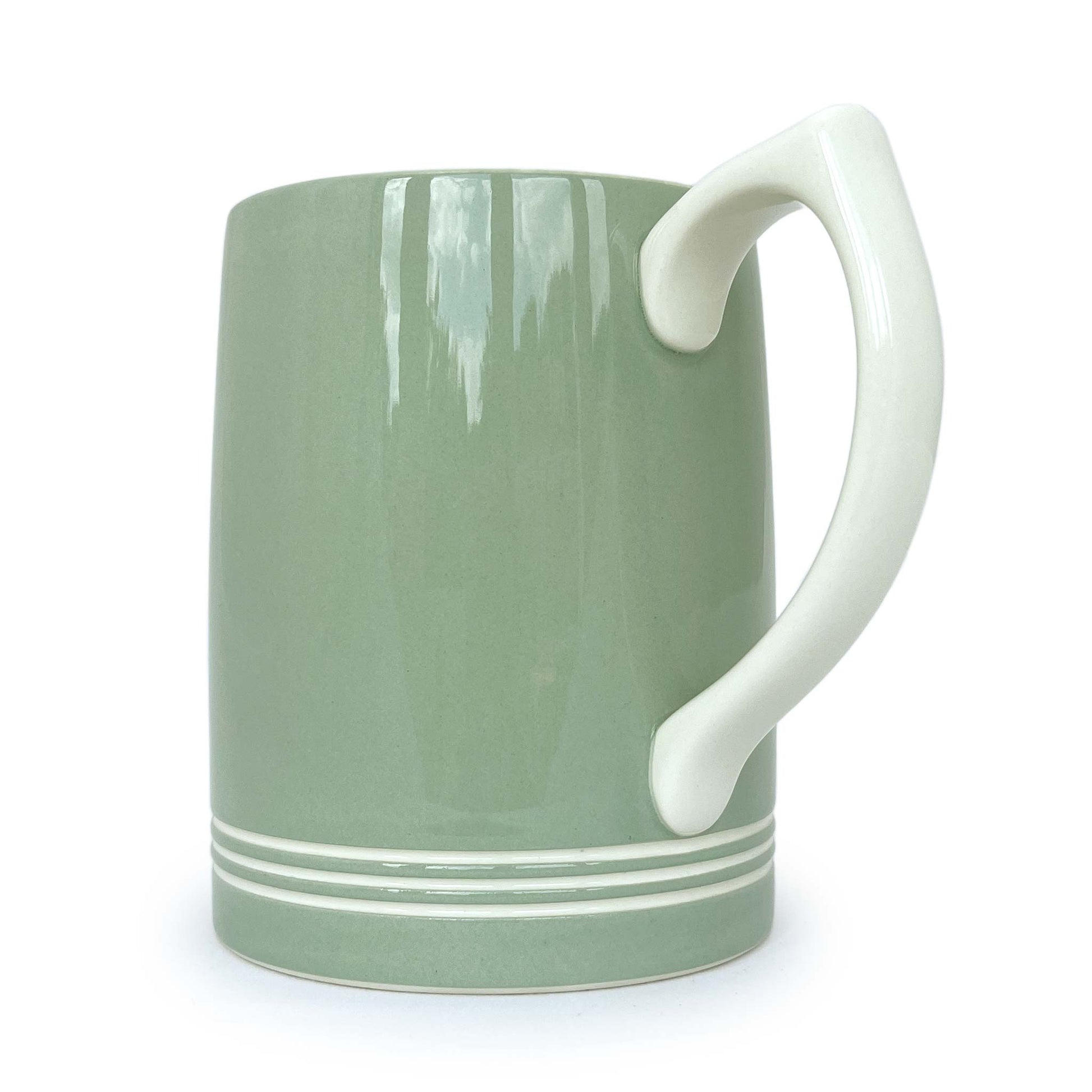 Vintage Wedgwood Keith Murray celadon tankard mug with white ribbed decoration and white handle from side