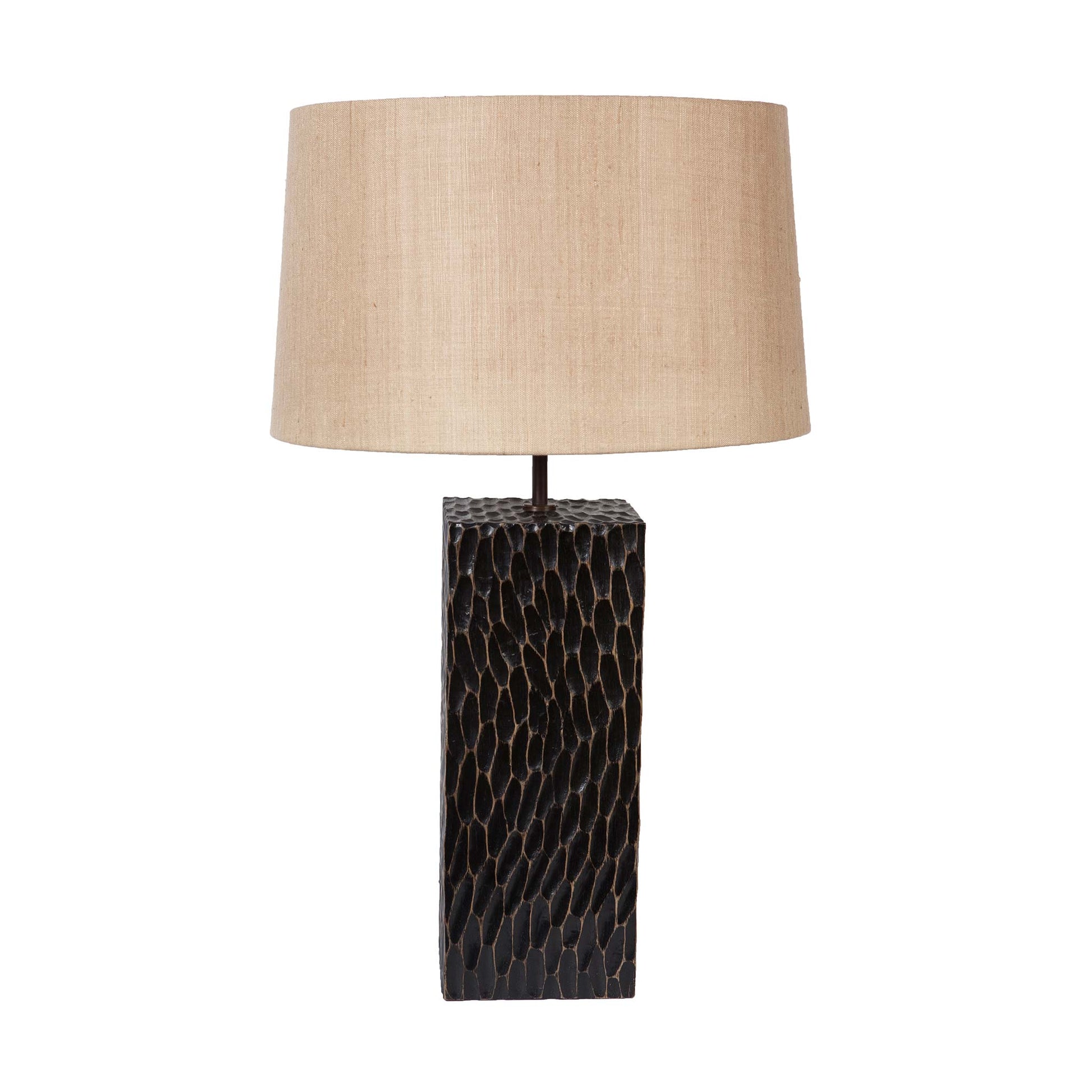 Rectangular block table lamp with a hand carved grooves. Black rectangular oak base and a beige tapered linen lampshade