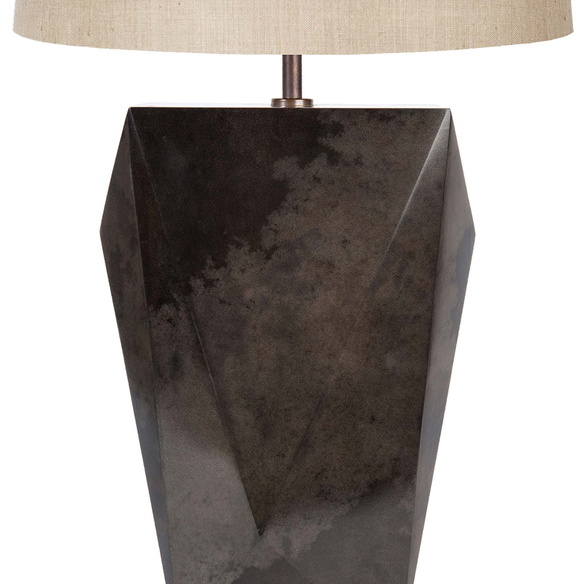 close up view of the faceted lamp body showing the smooth deep charcoal parchment