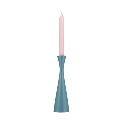 Minimal plain blue candleholder with tall pale pink dinner candle