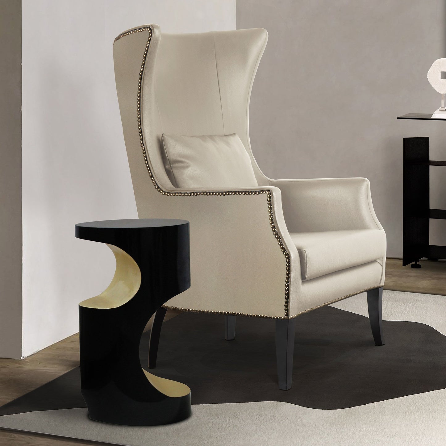 lifestyle shot of the gold and black lacquer side table in a luxury living room