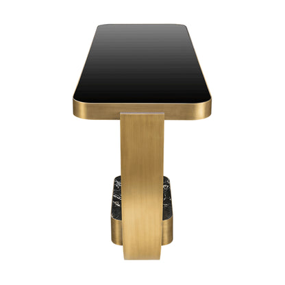 side view of the console table showing the inlaid black glass top and brass accents on the table structure