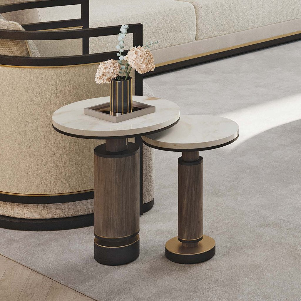 a lifestyle image of the two luxury brutalist side tables in a living room