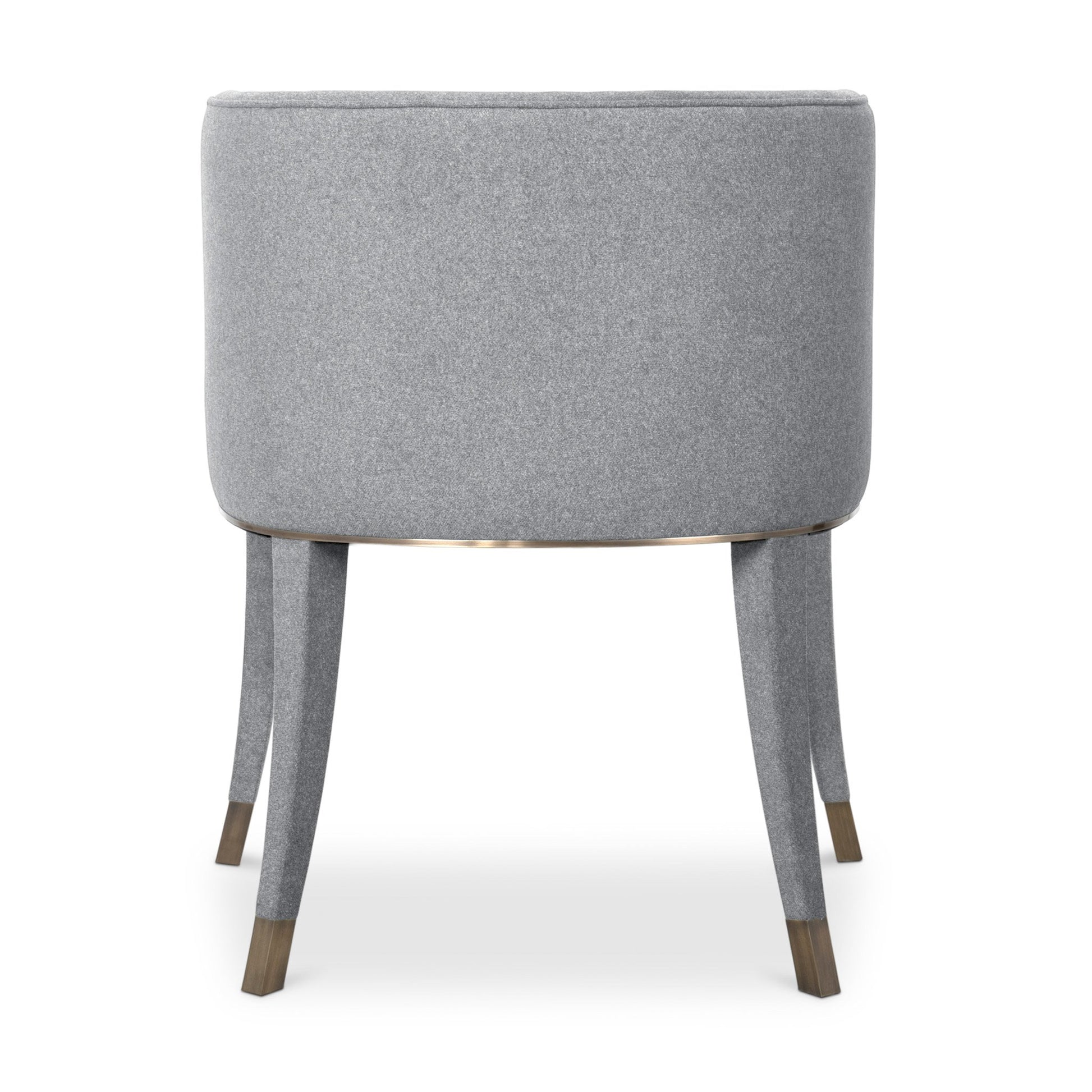 back view of the rich grey cotton velvet dining chair with a button-tufted inner back, upholstered legs, and aged brass detailing.