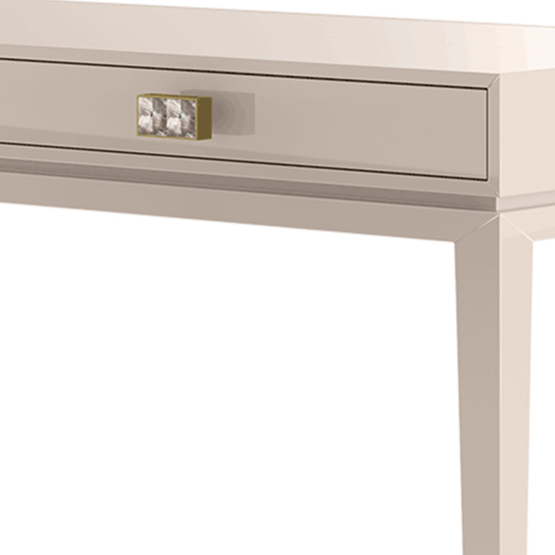 close up of the lacquered drawer front showing the pearl handles with brushed brass detailing