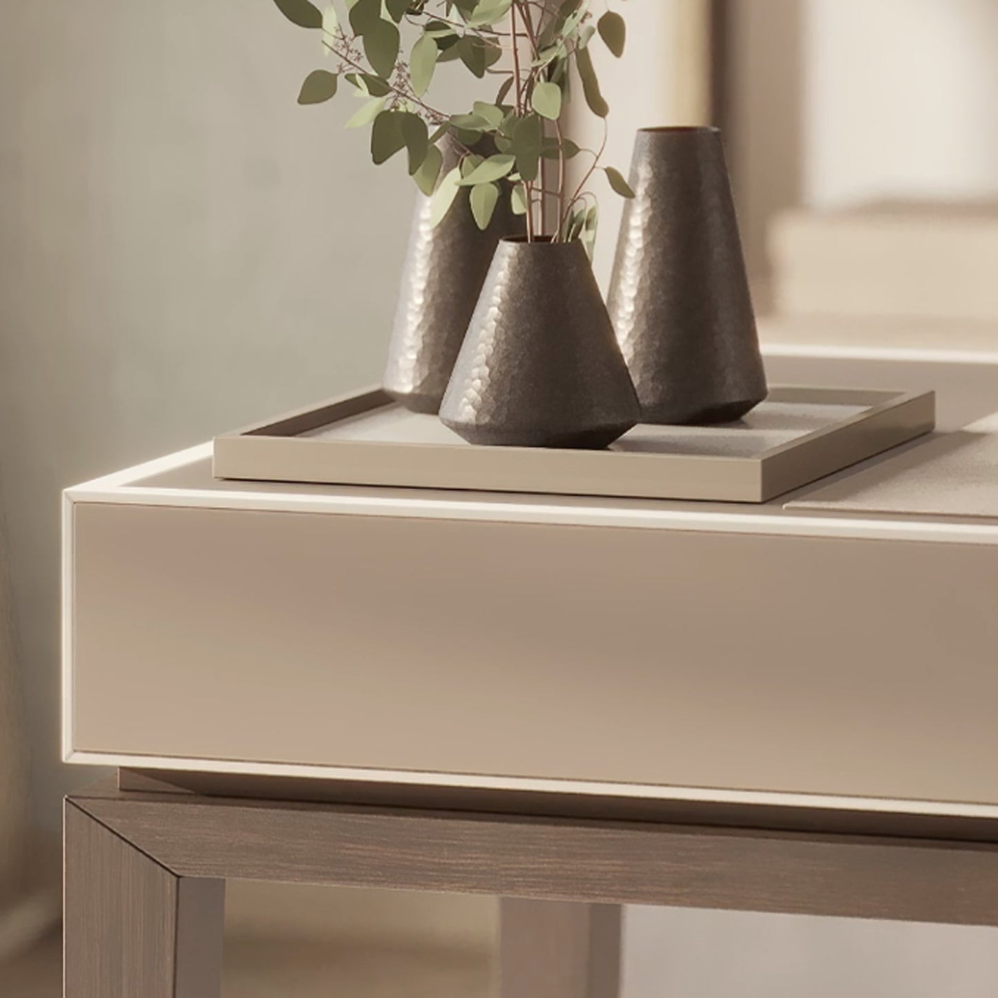 close up of the rectangular desk showing the high gloss lacquered wood box and frame, with a tray and vases on the desk top