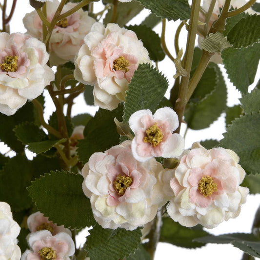 A miniature faux cream flower spray of wild meadow roses.   