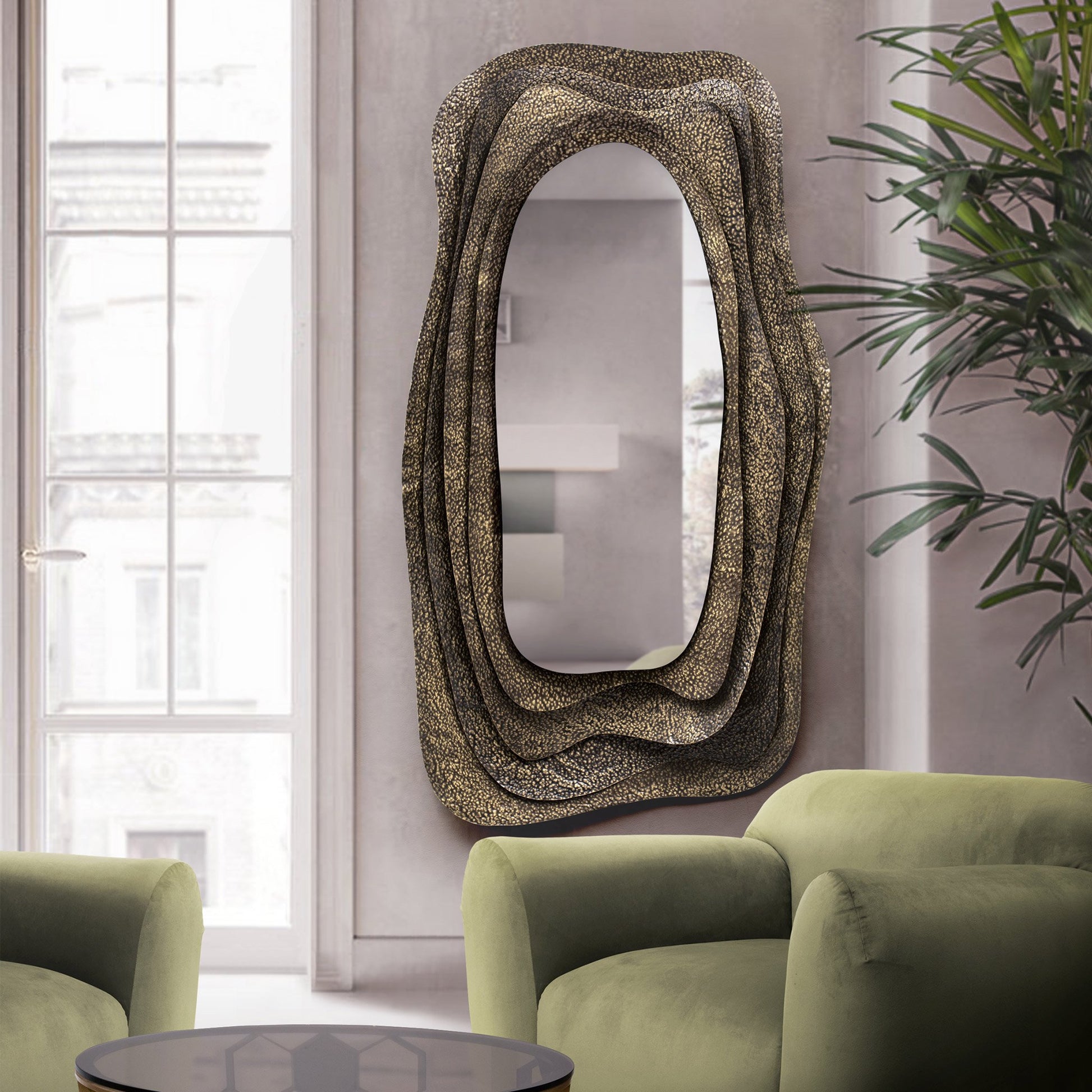 Dark brass sculptural mirror in luxury home