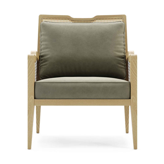 Pale modern wood frame rattan chair with velvet upholstered cushions in sage green.