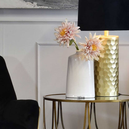 Lifestyle image of white crackle glazed vase, tapered form with small neck.