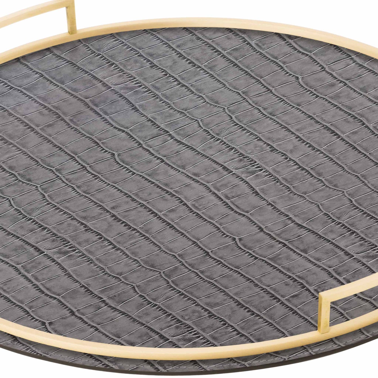 Close up of round grey crocodile textured Italian leather tray with brass handles