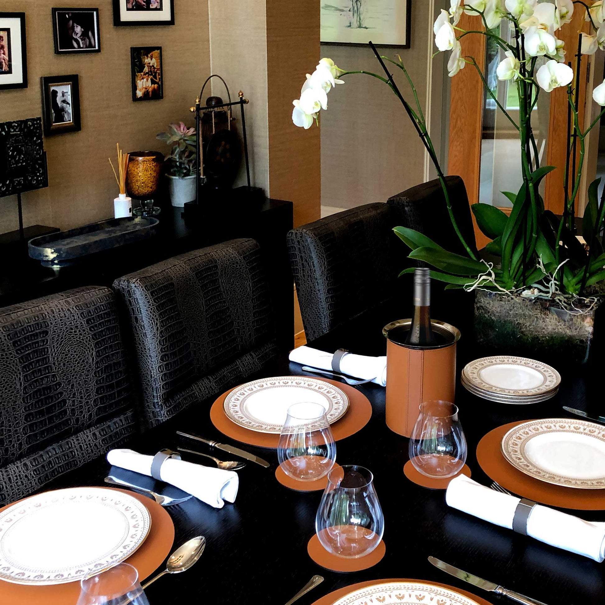 a lifestyle image showing the leather wine cooler in use on a set table