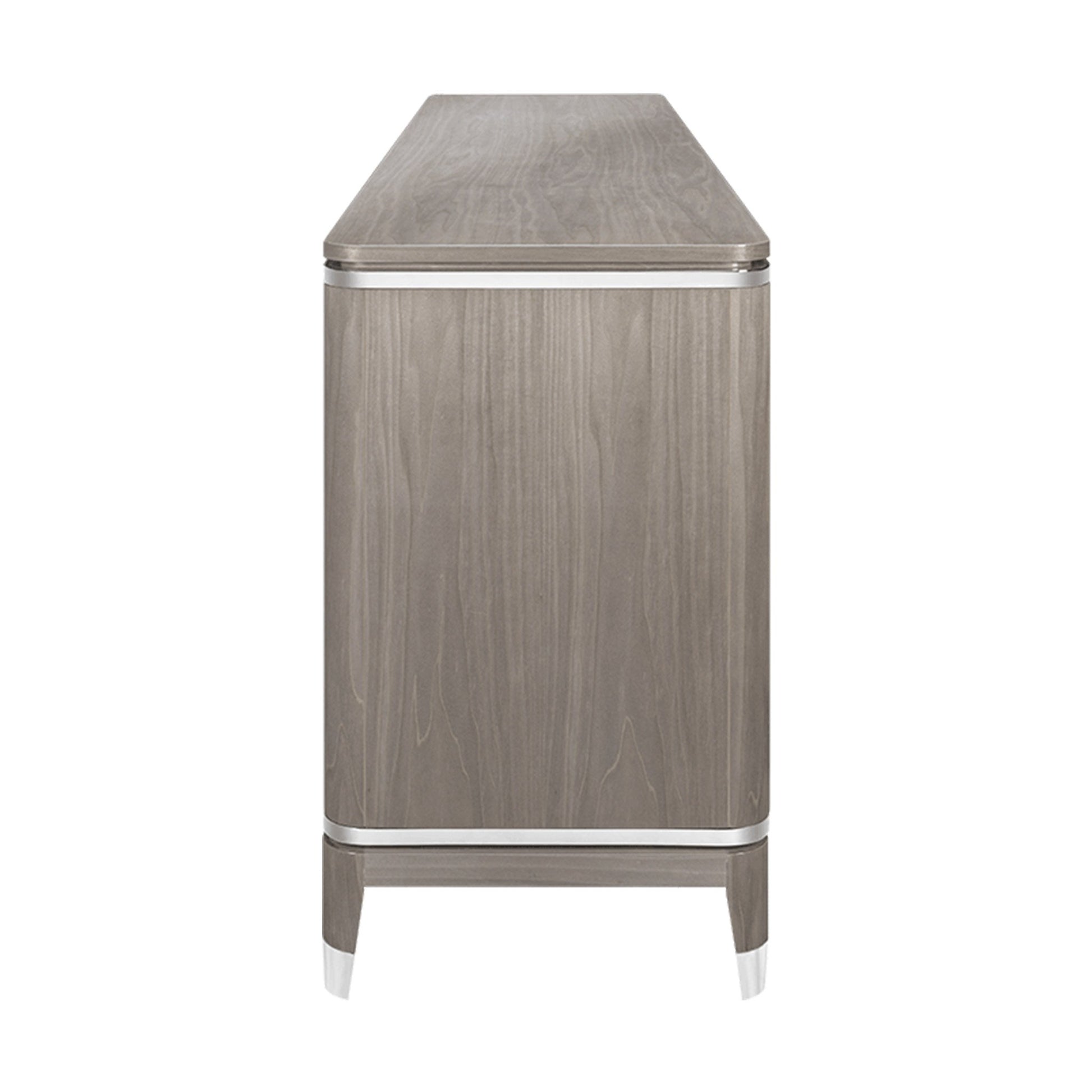 Side view of luxury sideboard with high gloss light wood veneer and stainless steel and mother of pearl detail and inlay.