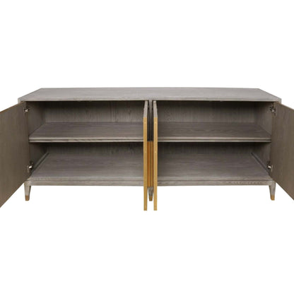 Interior of light oak four door cabinet with long brass handles and brass feet