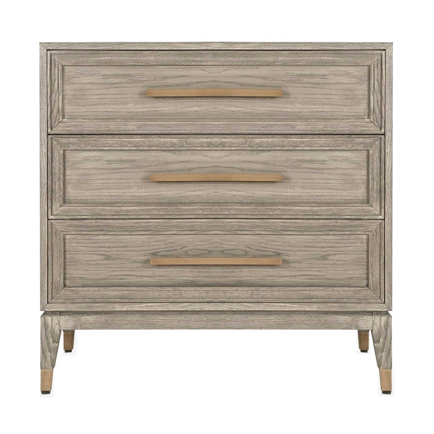 Light oak chest of three drawers with long brass handles and brass feet