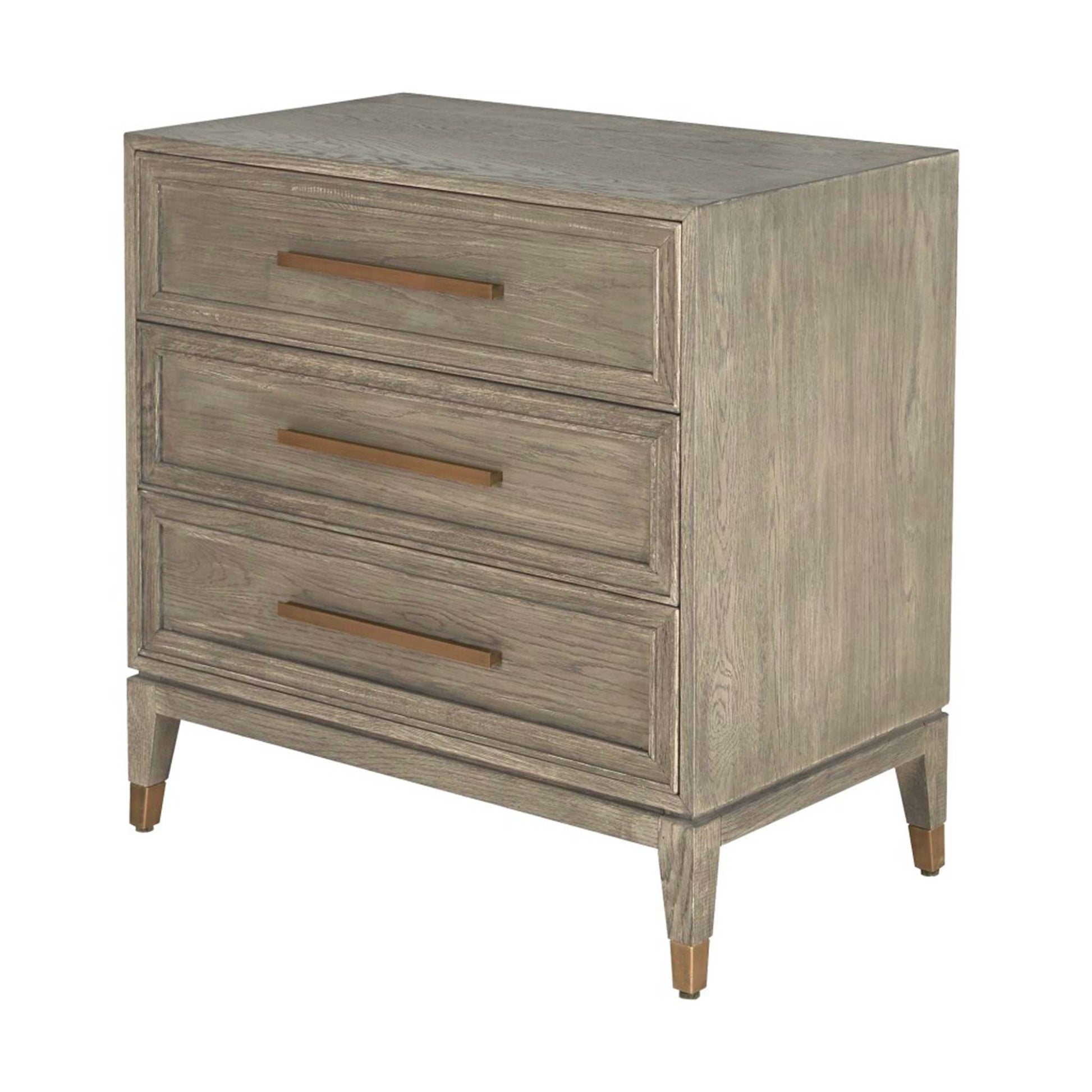 Light oak chest of three drawers with long brass handles and brass feet