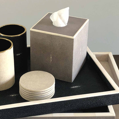 Lifestyle image of square grey shagreen luxury tissue box with white bone trim. Displayed with other shagreen trays, coasters and pen pots.