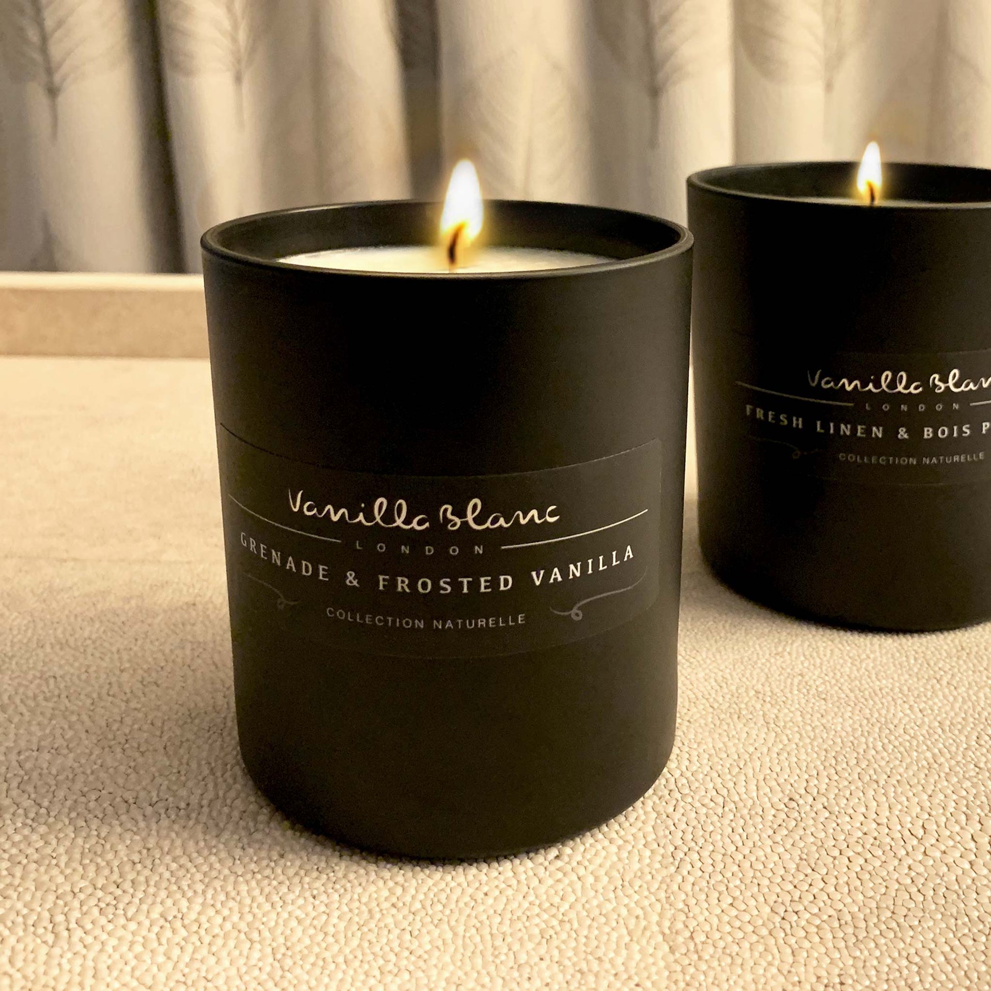 Grenade and Frosted vanilla organic candle in matt glass jar on shagreen tray. Lifestyle image.