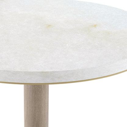 close up image showing the white marble stone top and brushed brass detailing